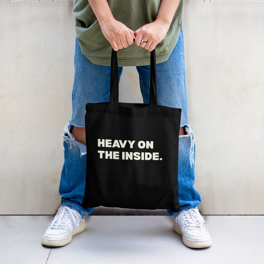 Minimalist black tote bag with statement print and sturdy canvas construction