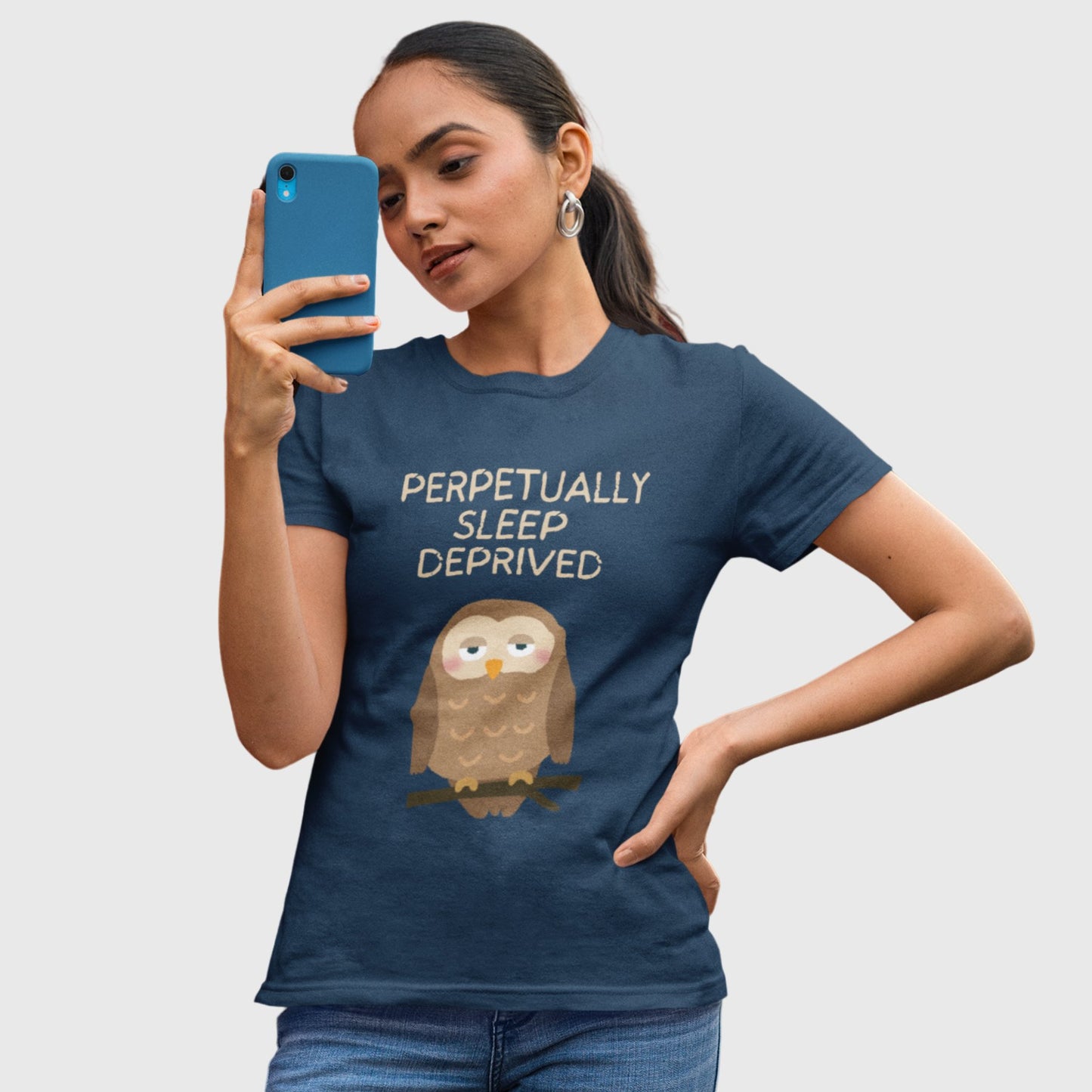 Lifestyle photo of a woman in a funny “Always Tired” t-shirt — relatable moodwear for overworked, under-rested humans by The Grumpy Ninja.