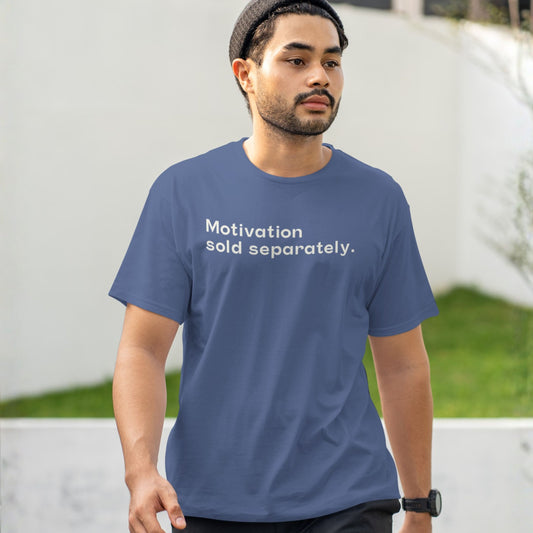Person wearing a funny quote oversized t-shirt with the text “Motivation sold separately.”