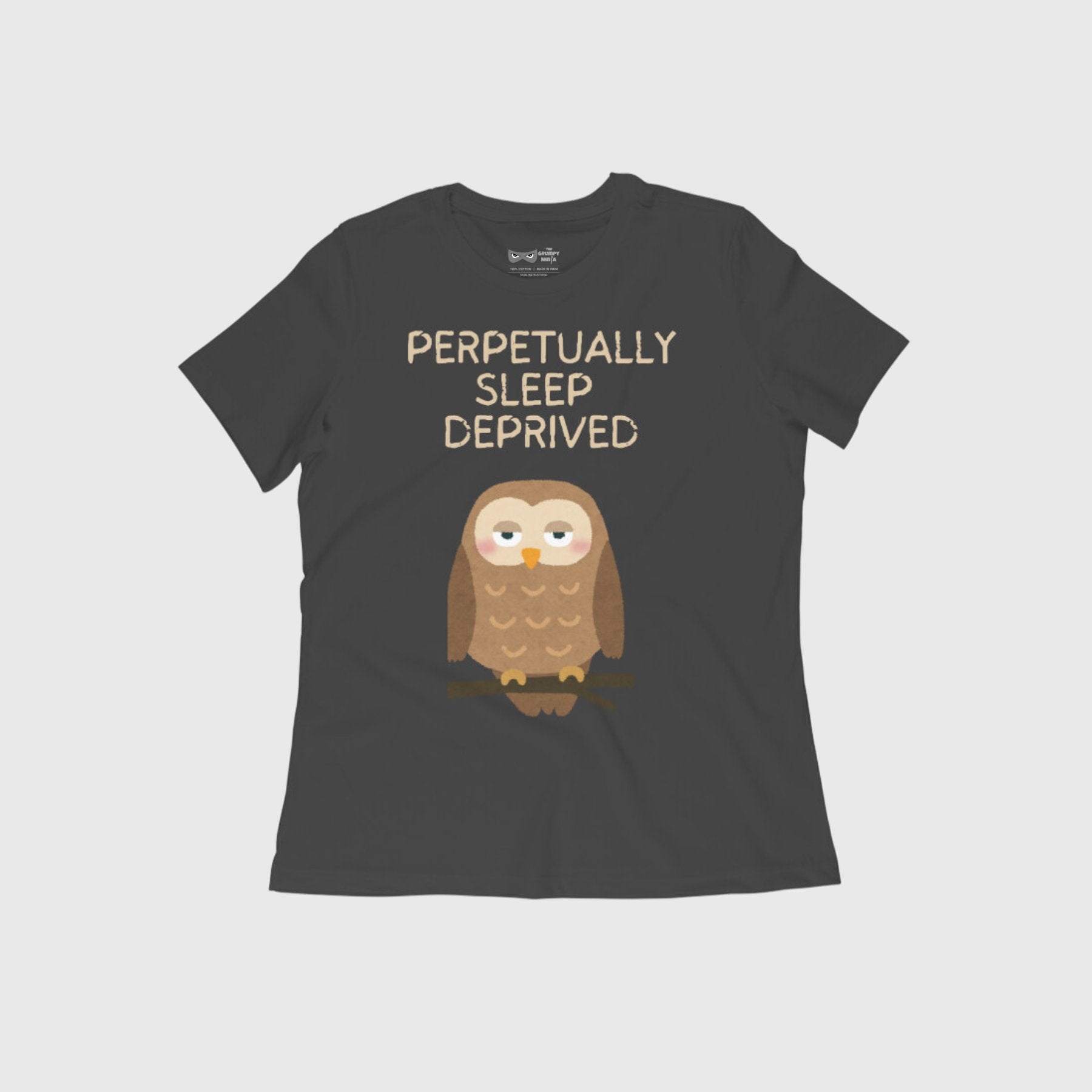 Close-up of witty quote “Perpetually Sleep Deprived” printed on soft cotton fabric — funny relatable t-shirt from The Grumpy Ninja.
