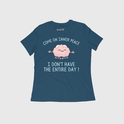 Flat lay of a cotton graphic t-shirt with the sarcastic quote “Come on Inner Peace, I don’t have the entire day” — a funny tee for overthinkers by The Grumpy Ninja.