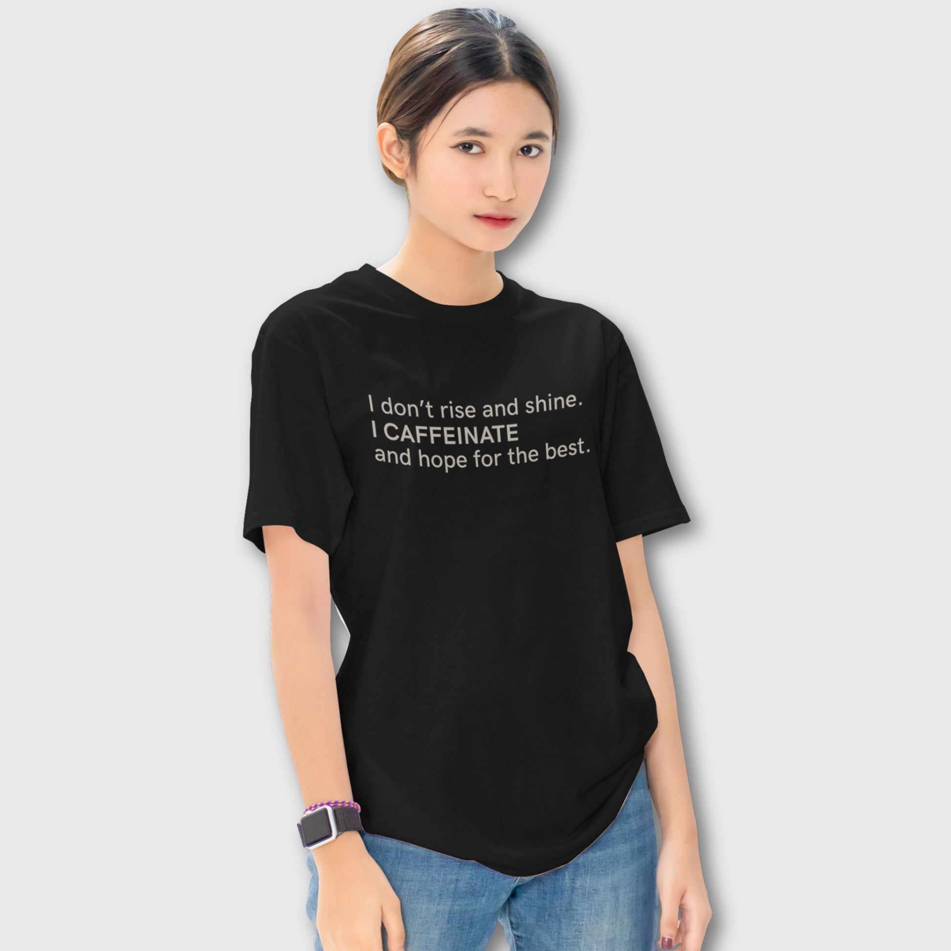 Oversized black unisex t-shirt with the quote “I don’t rise and shine. I caffeinate and hope for the best.”