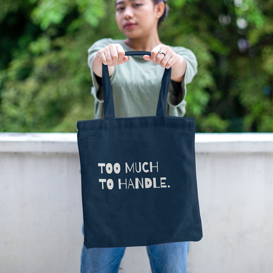 Navy canvas tote bag featuring a bold cream typography design