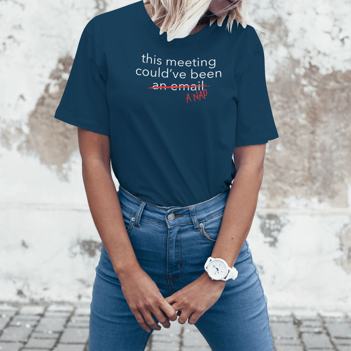 Woman wearing a navy blue office humor T-shirt with a sarcastic meeting message