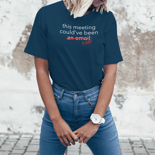 Woman wearing a navy blue office humor T-shirt with a sarcastic meeting message