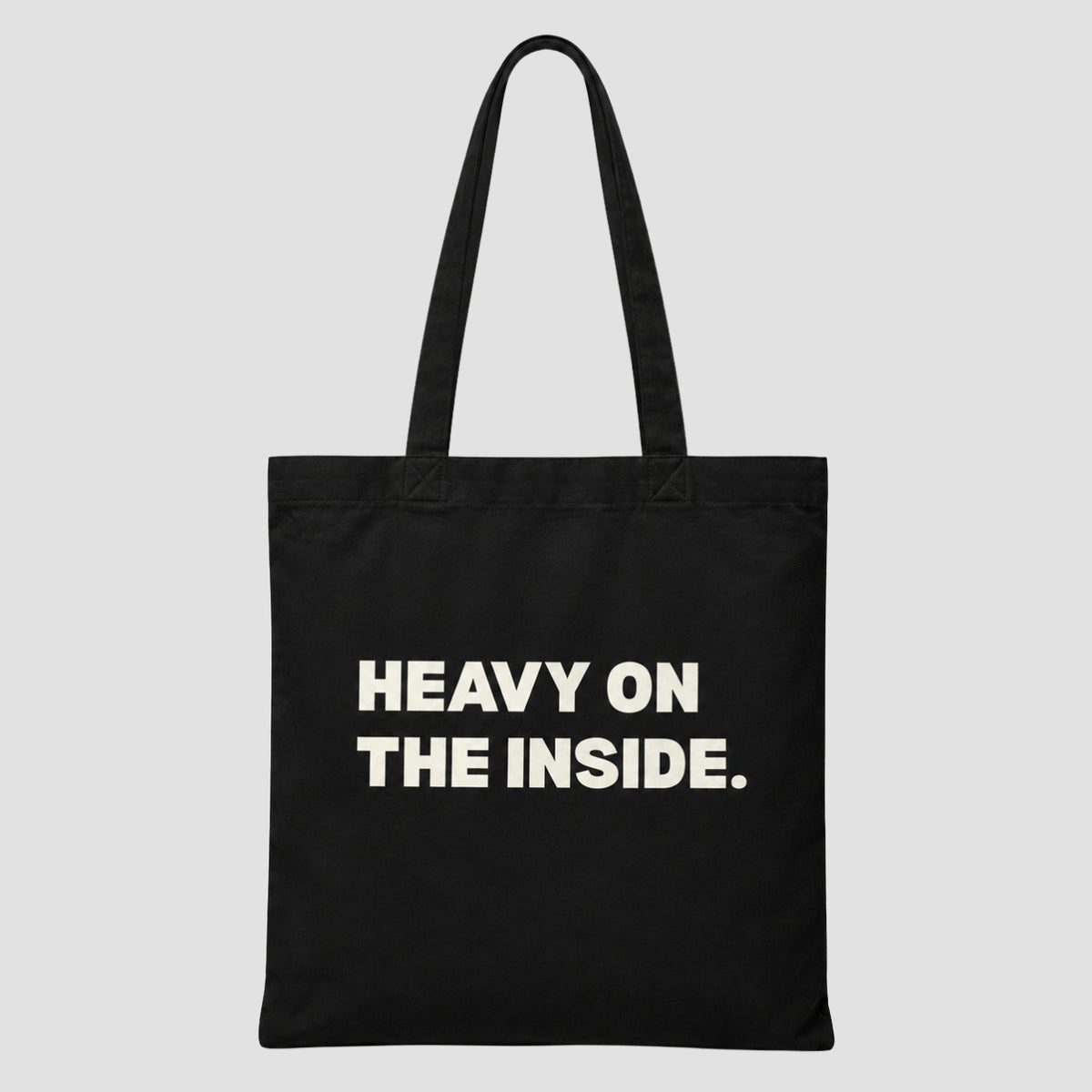 Printed canvas tote bag in black with a bold typographic design