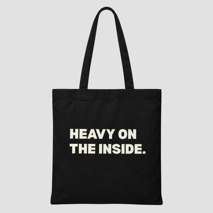 Printed canvas tote bag in black with a bold typographic design