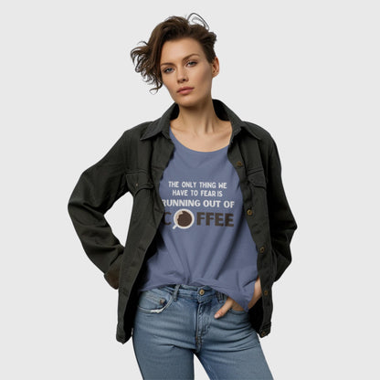 Woman wearing silver-blue coffee quote t-shirt with text “The Only Thing We Have to Fear Is Running Out of Coffee.”